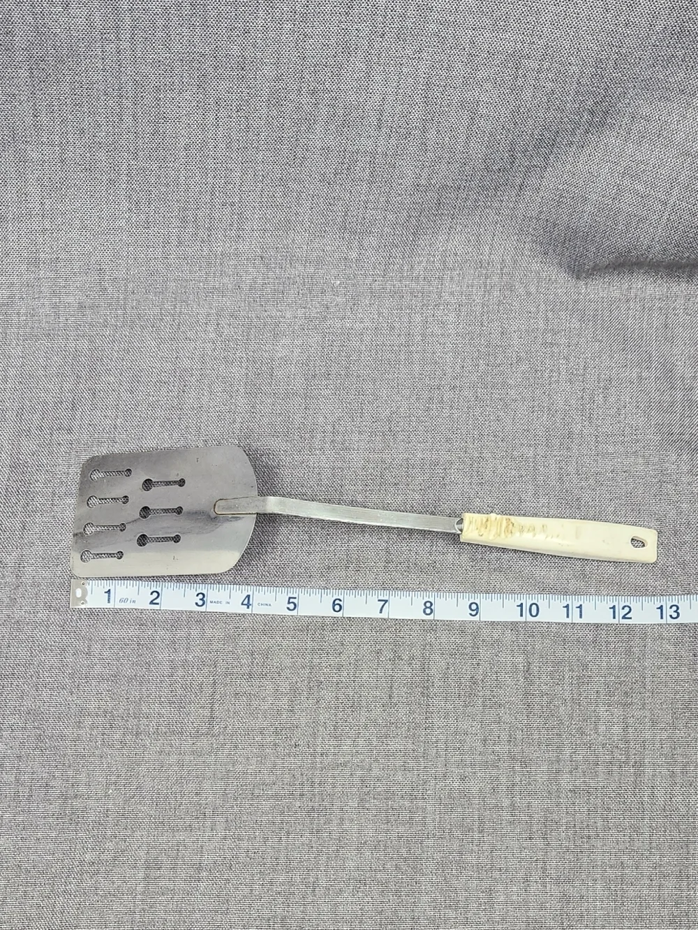 Vintage Ekco Stainless Steel Slotted Spatula White Handle.